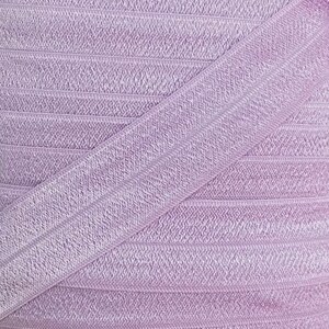 May include: A close-up of a lilac elastic band with a ribbed texture. The band is folded in half, showing the inside and outside of the fabric.