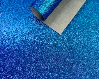 Lámina de tela con brillantina azul rey de 23 x 30 cm. Lámina fina con brillantina y reverso de lona. Ideal para proyectos infantiles, decoración del hogar, bolsos, joyas y lazos para el pelo.
