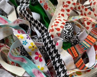 Bolsa de 20 yardas con una variedad de elásticos estampados Foe de 5/8" plegables para coleteros, proyectos festivos y diademas.