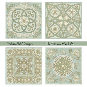 May include: Four square tiles with a repeating pattern of geometric shapes in shades of blue, green, and gold. The tiles are arranged in a grid pattern. The text "Tile Pattern Wall Art" is printed below the tiles.