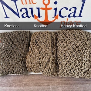 May include: Three different types of brown fishing nets: knotless, knotted, and heavy knotted. The nets are displayed on a wooden surface.