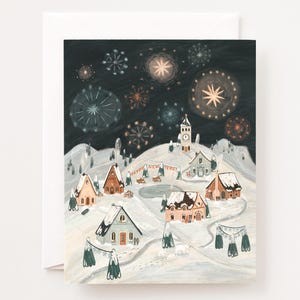 May include: A greeting card with a winter village scene. The illustration depicts snow-covered houses, a church, and fireworks in a dark night sky. The words "Happy New Year" are written on a banner. The card is set against a white background.