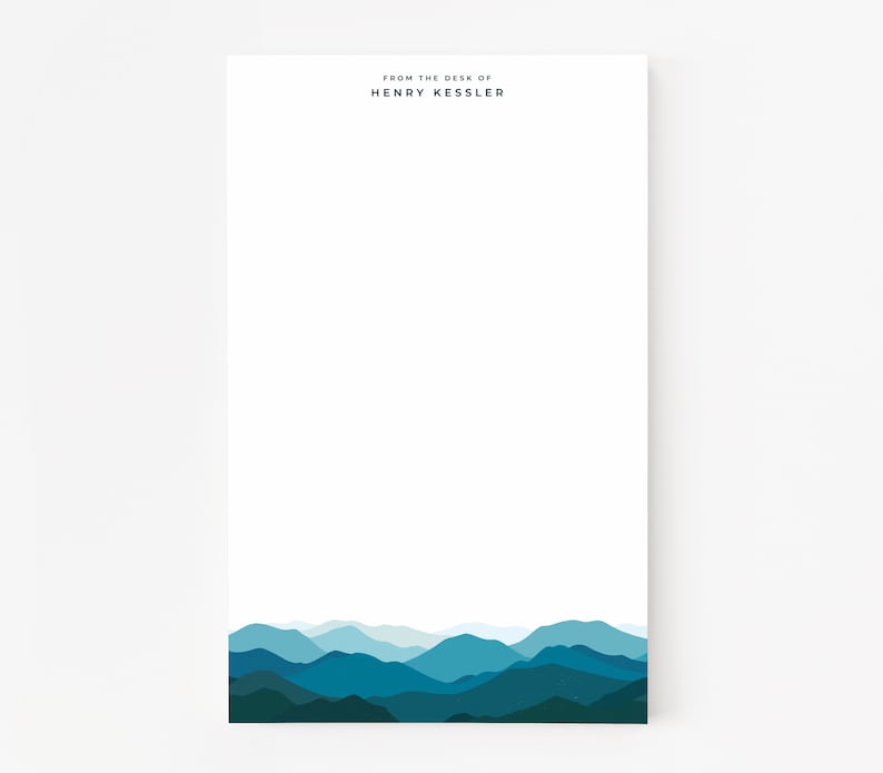 May include: A white notepad with the text "From the desk of Henry Kessler" at the top and a blue mountain range at the bottom.
