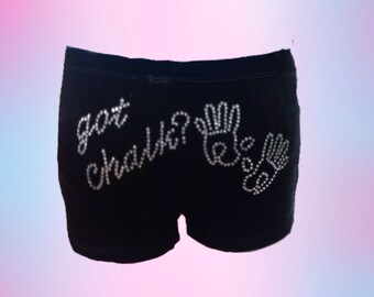 May include: Black cotton shorts with the words "got chalk?" and two handprints in rhinestones.