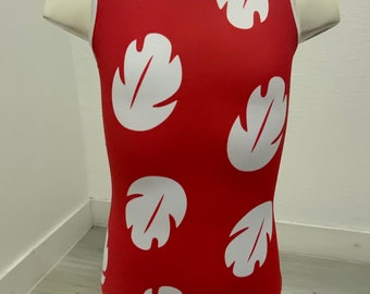 May include: Red sleeveless leotard with a white trim around the neckline and white leaf designs throughout.