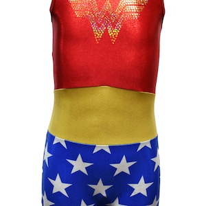 May include: Red, yellow, and blue leotard with a Wonder Woman logo made of rhinestones. The leotard has a star pattern on the bottom.