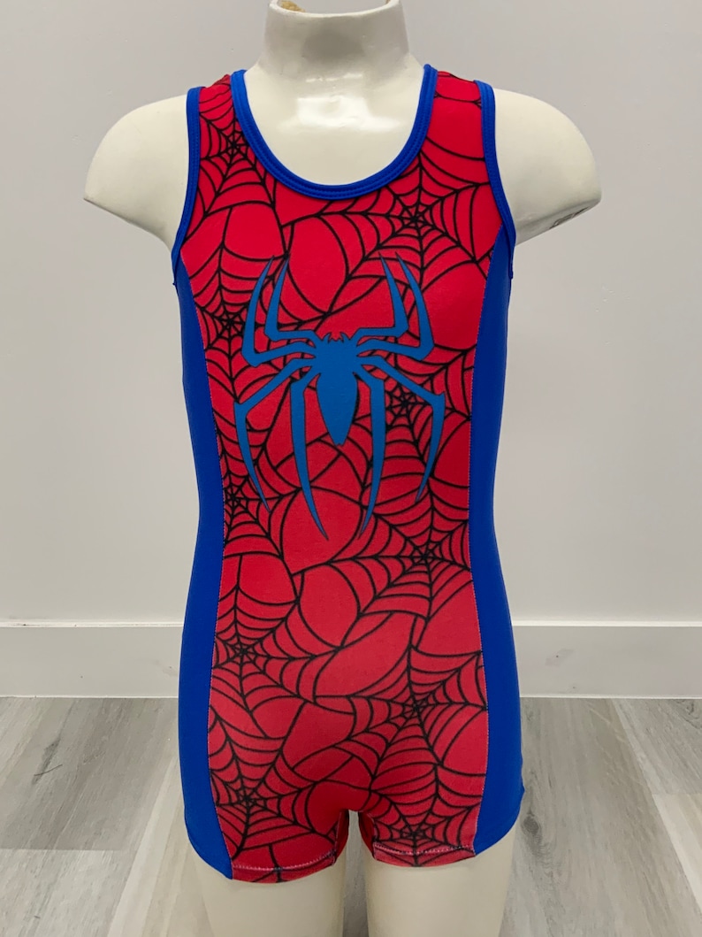 May include: Red and blue gymnastics leotard with a spider web pattern and a blue spider graphic.