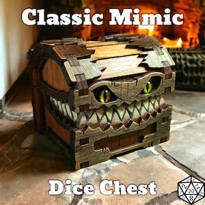 May include: A wooden dice chest with a monster-like design. The chest features a hinged lid, a toothy grin, and glowing yellow eyes. The text "Classic Mimic" and "Dice Chest" are displayed on the image.