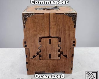 May include: A wooden deck box with the text "Mechanical Commander" and "Oversized Magic: The Gathering Deck Box." The box is brown with decorative metal corner accents and a gear-shaped design on the front.
