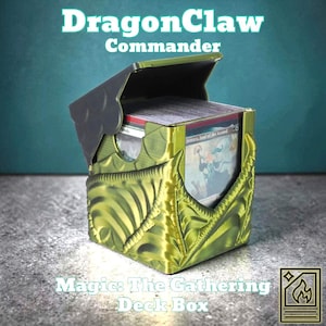May include: A green and black deck box with the text "DragonClaw Commander" and "Magic: The Gathering Deck Box." The box is open, revealing a stack of cards. The box has a dragon scale design.