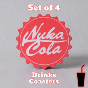 May include: A set of four red drinks coasters featuring the "Nuka Cola" logo in white. The coasters have a circular shape with a scalloped edge. The words "Drinks Coasters" are printed below the logo. A black drink silhouette with a straw is in the lower right corner.