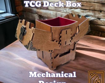 May include: A wooden deck box with the text "Magic: The Gathering TCG Deck Box" and "Mechanical Design". The box has a red interior and is open, revealing the inside. The box is made of wood and has a decorative metal clasp.