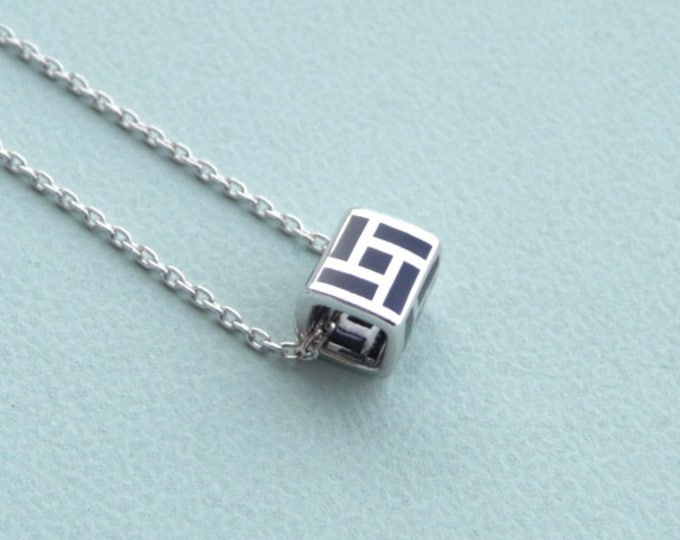 Guy Laroche (France). Silver pendant and black lacquer.