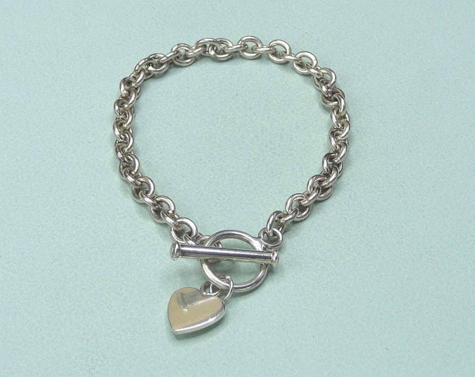 Silver bracelet with heart-shaped charm. Vintage.