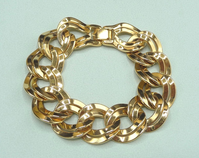 United States (Monet). Wide gold-plated metal bracelet. 1980s. Vintage.