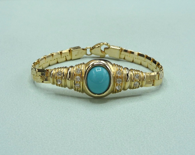 Vintage gold metal bracelet, decorated with a turquoise resin element.