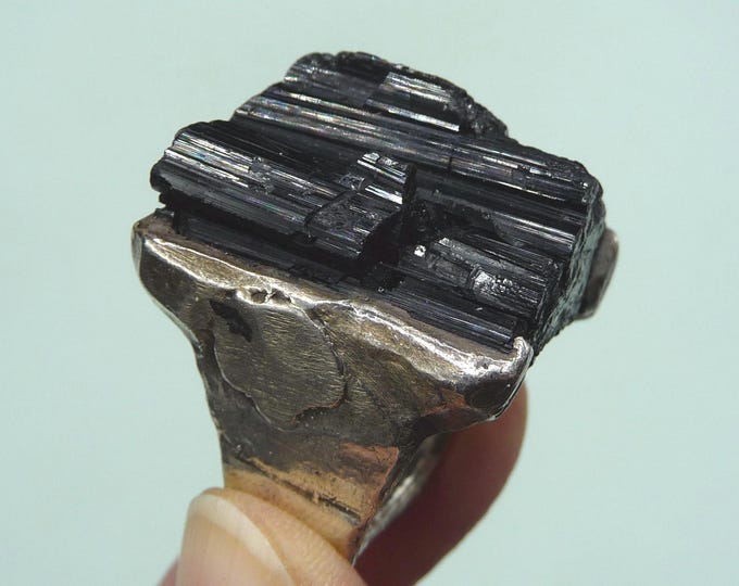 United States. Heavy silver ring with raw tourmaline.
