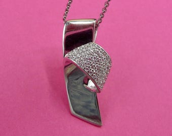 Silver and zircon pendant by French fashion designer Guy Laroche