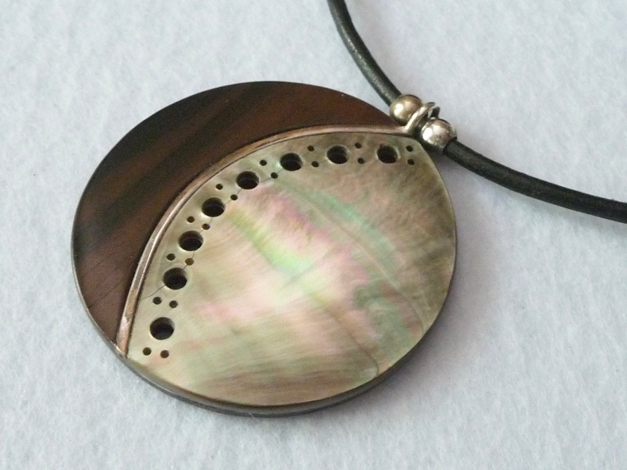 Claude Dasque (France). Necklace: ebony, mother of pearl, silver.