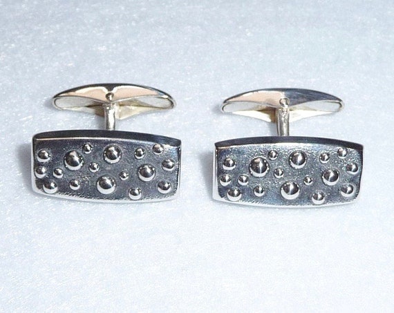 Ancienne paire de boutons de manchettes, en argent