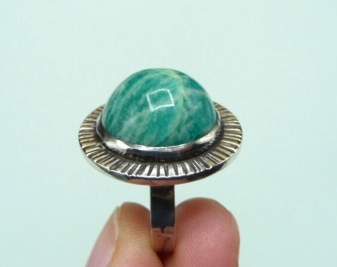 Silver ring decorated with a green stone. Vintage.