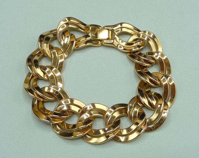 United States (Monet). Large gold metal bracelet. 1980s. Vintage.