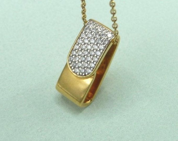 Guy Laroche (France). Gold-plated and zircon pendant.