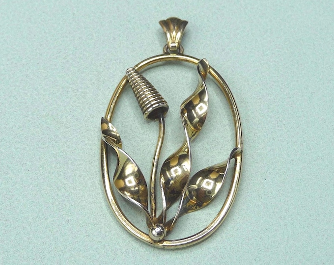 Silver pendant with a gold finish. Vintage.