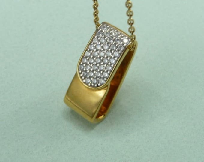 Guy Laroche (France). Gold-plated and zircon pendant.