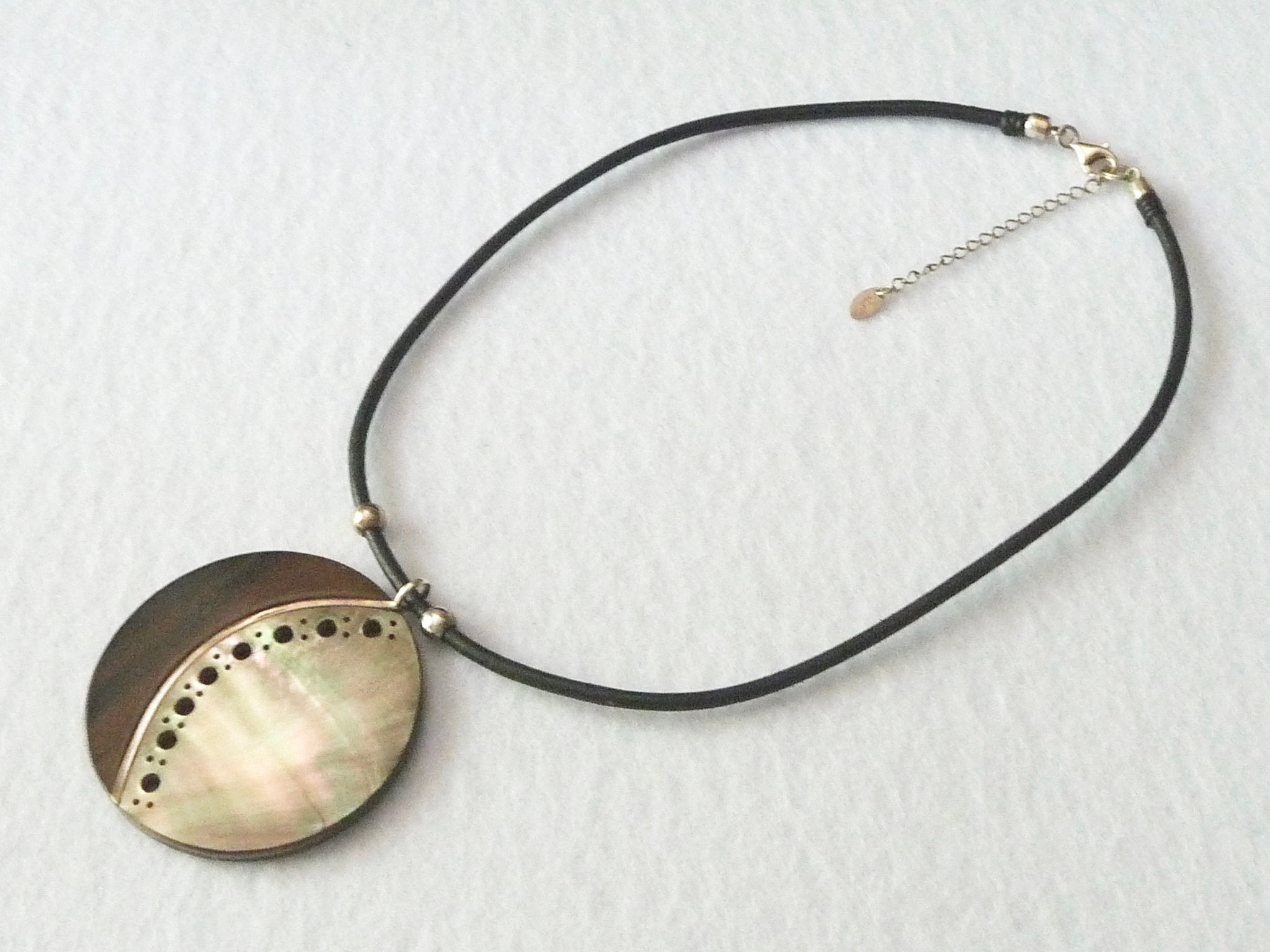 Claude Dasque (France). Necklace: ebony, mother of pearl, silver.