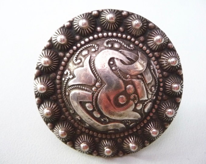 Low silver pin title. Vintage.