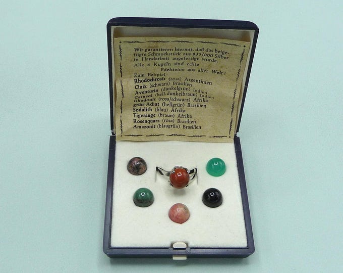 Silver ring with stone beads of different colors. Vintage.