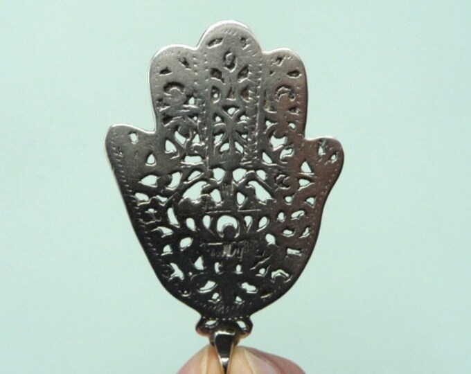 Vintage silver pendant. Khamsa or “hand of Fatma”.