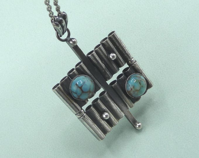 Silver pendant decorated with two stones. Vintage.