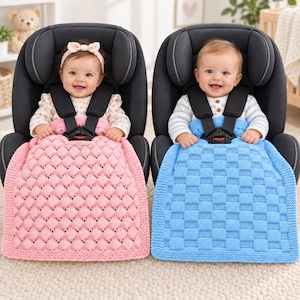 May include: Two infants sit in black car seats, one covered by a pink knitted blanket with a textured bobble pattern and the other by a blue knitted blanket with a square grid pattern. Both blankets feature thick, solid-knit borders.