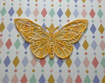 Freestanding lacework butterfly appliqué.