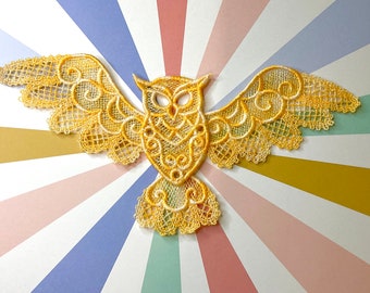 Gold owl lacework appliqué.