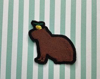 Embroidered whimsy sew on/iron on patch: Capybara and yuzu.
