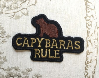 Embroidered whimsy iron on patch: Capybaras Rule.