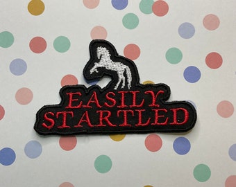 Embroidered merit iron on patch: Easily Startled.