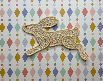 Running Hare lacework brooch: Light brown.