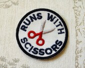 Crafting merit embroidered iron on patch: Runs with scissors.
