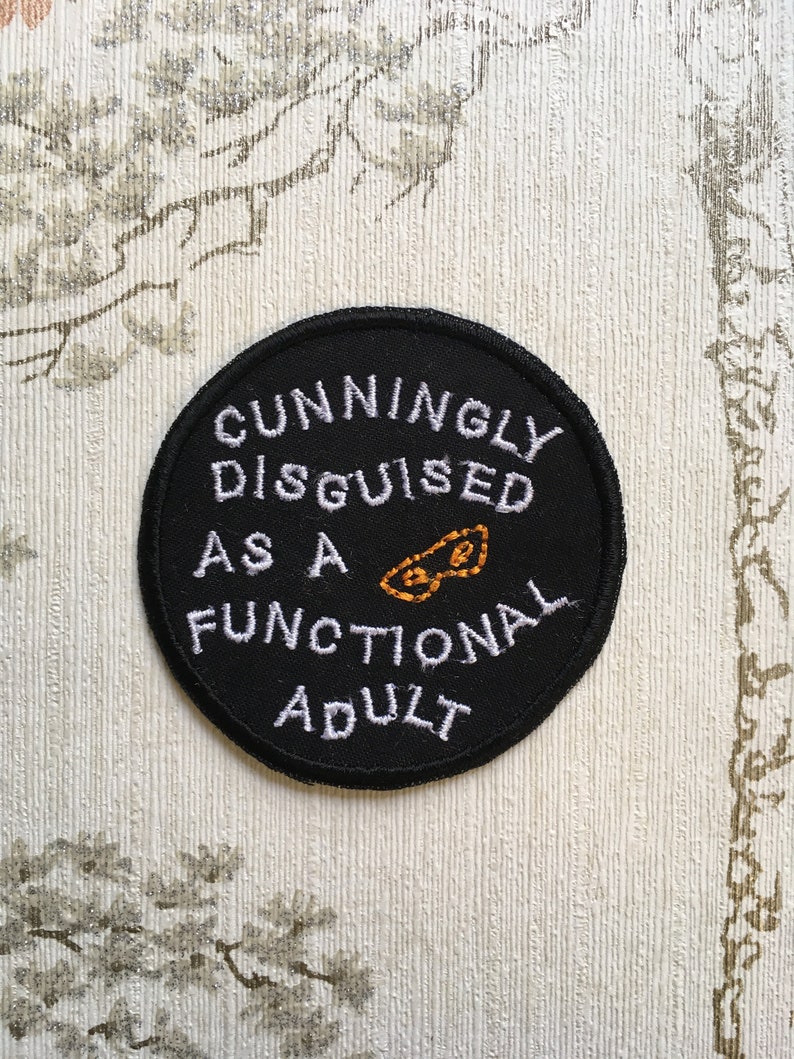 Embroidered merit iron on patch: Cunningly disguised as a functional adult. image 1