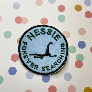 Embroidered cryptid iron on/sew on patch: Nessie Forever Searching.