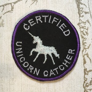 Embroidered merit iron on patch: Certified Unicorn Catcher. image 1