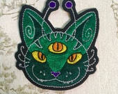 Embroidered whimsy iron on patch: Alien Cat.