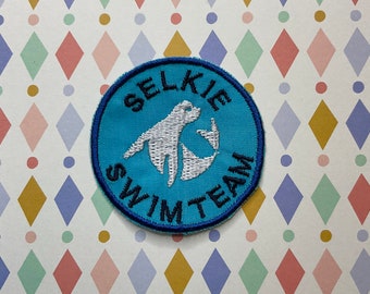 Embroidered cryptid sew on/iron on patch: Selkie Swim Team.