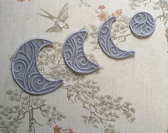Freestanding lacework gray moon phases appliqué.