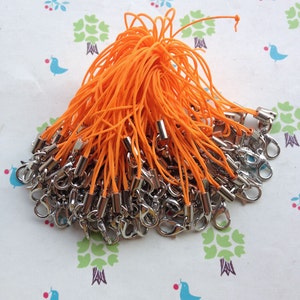 100pcs Orange Cell phone straps with white k lobster clasp included. 7cm long.Mobile phone line,Give cell phones some charm.