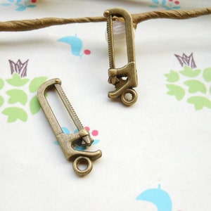 SALE--100pcs of Antique Bronze saw  pendant charm Size:25mmx13mm